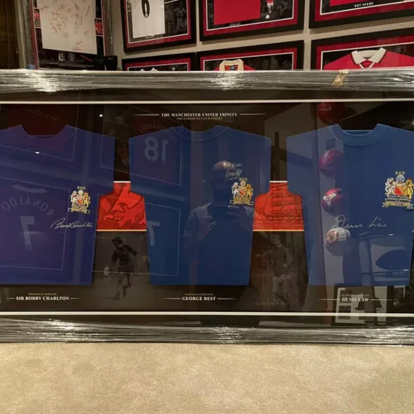George Best, Denis Law and Sir Bobby Charlton signed Manchester United shirt