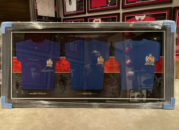 George Best, Denis Law and Sir Bobby Charlton signed Manchester United shirt